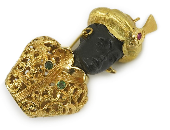 A late 20th century Italian 18k gold charm bracelet, hung with six assorted Italian 18k gold and gem set mounted blackamoor busts, together with a matching brooch